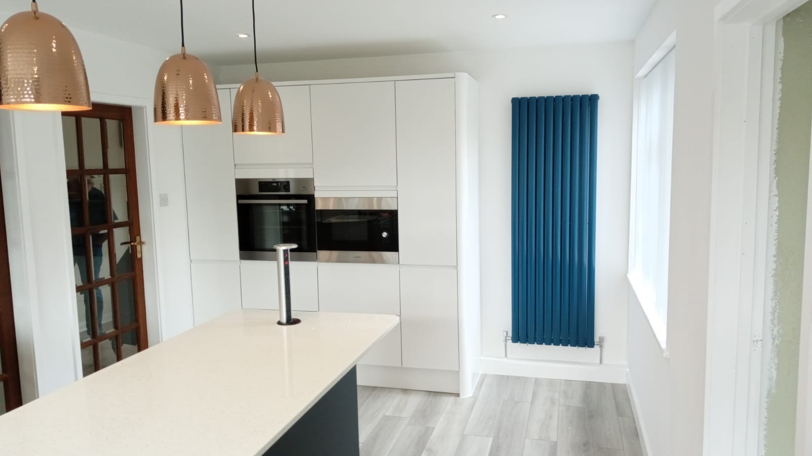 High-end kitchen with blue radiator feature